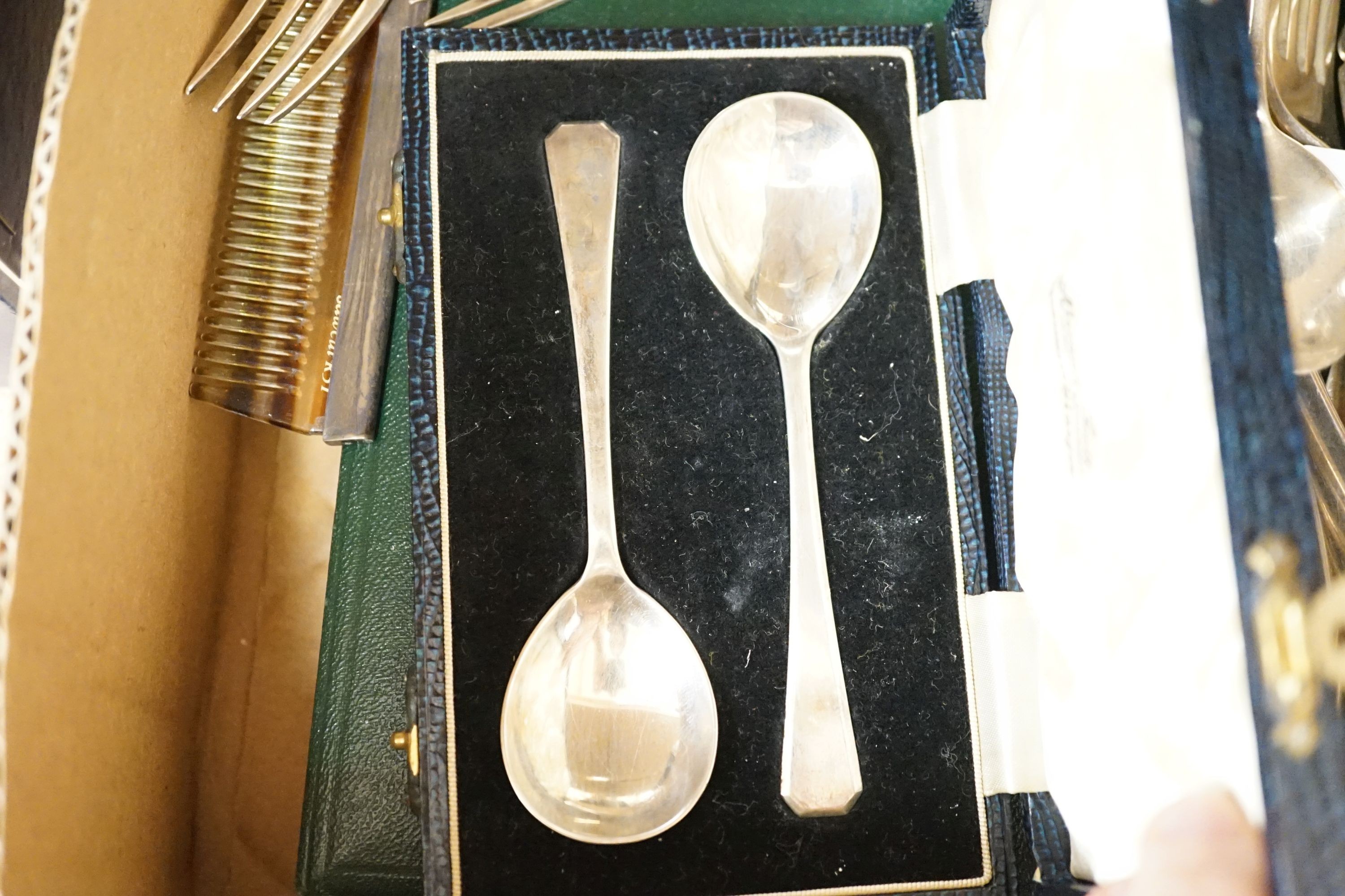 A mixed collection of sundry English silver to include unboxed flatware, a cased set silver teaspoons with tongs, further boxed cutlery including plated a four piece silver and enamel mounted glass dressing table set (en